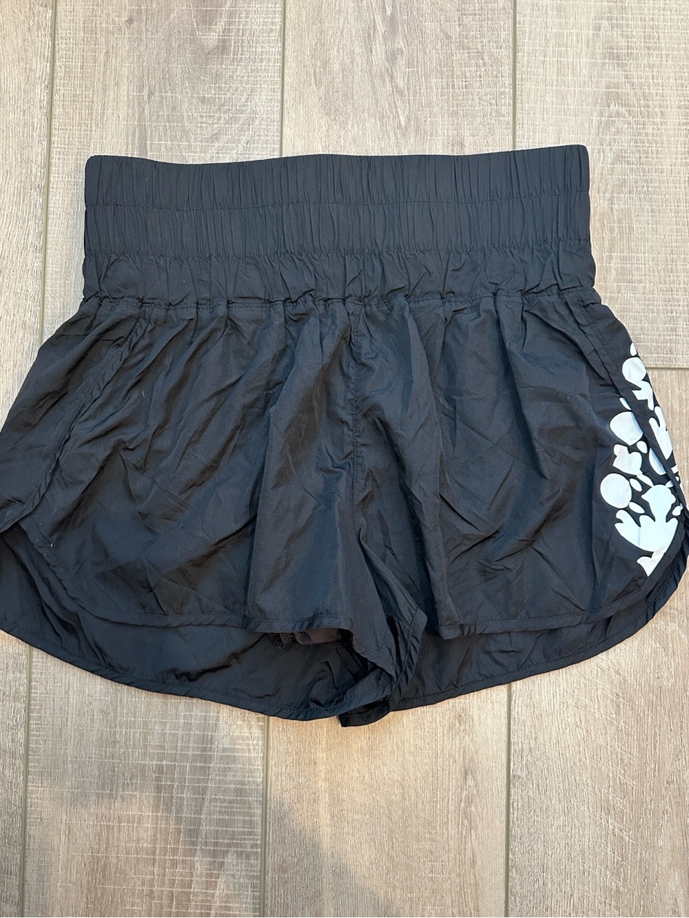 FP Movement by Free People Black Athletic Shorts with White Floral Side Accent